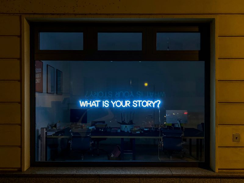 "The sign in the window says, "What is Your Story?"